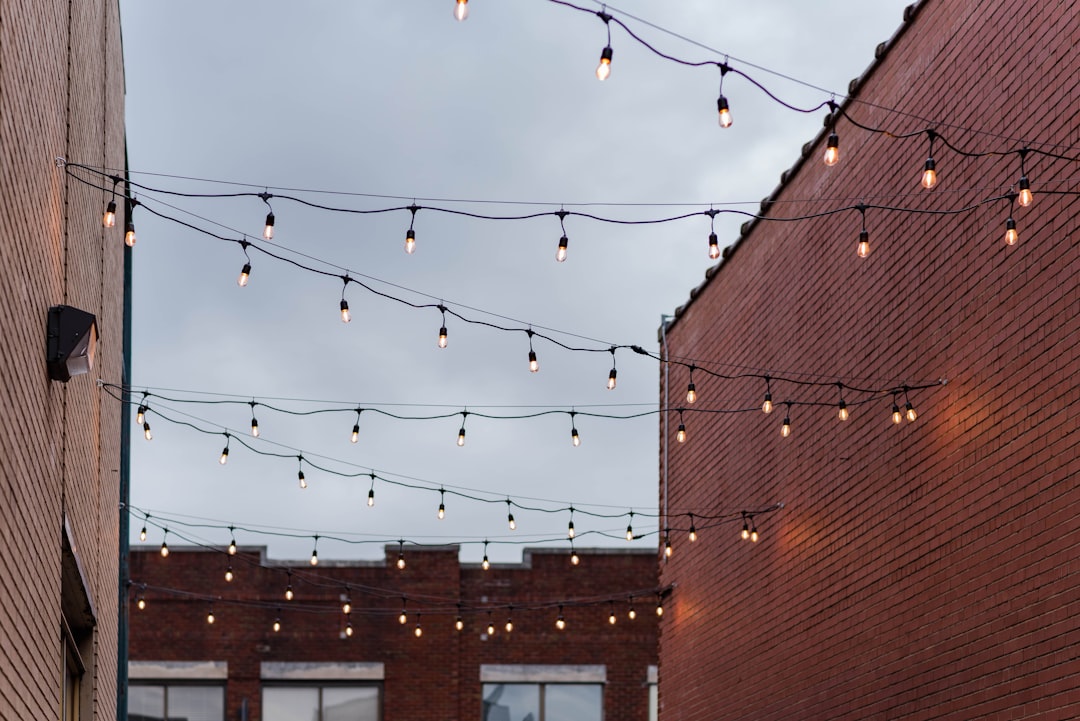 a brick building with a bunch of lights hanging from it