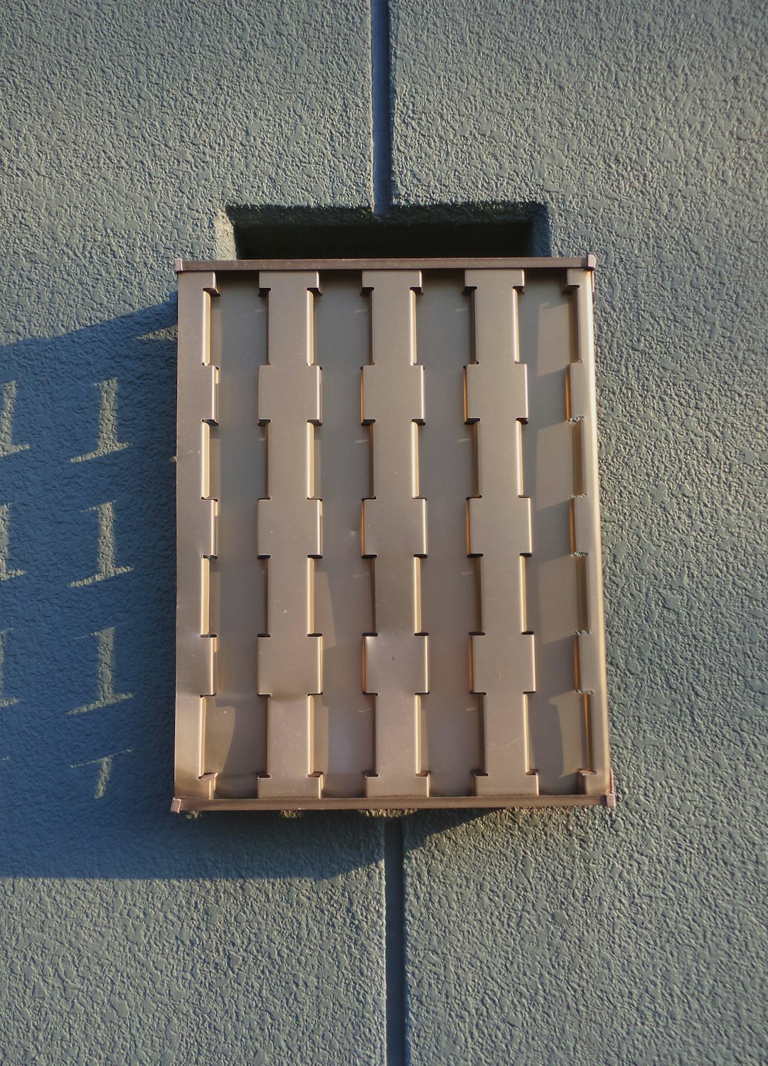 the shadow of a window on a wall