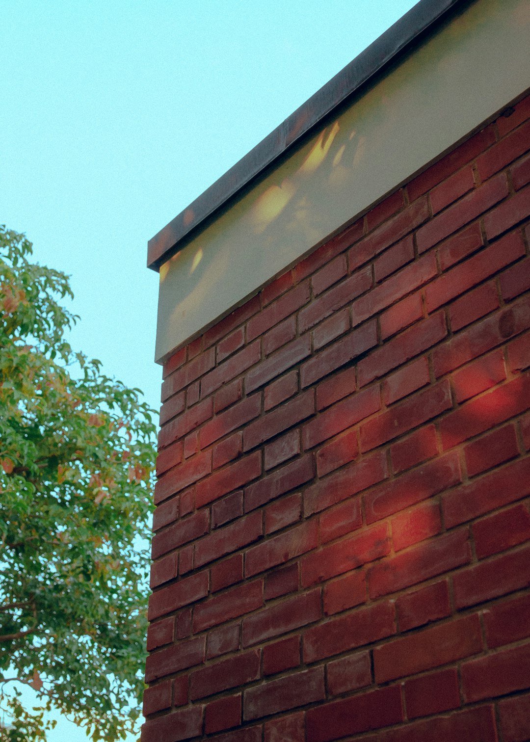 a brick building with a clock on the side of it