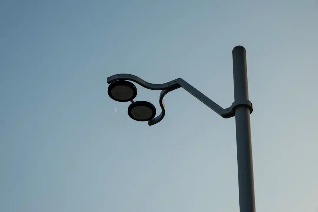 a street light with a blue sky in the background