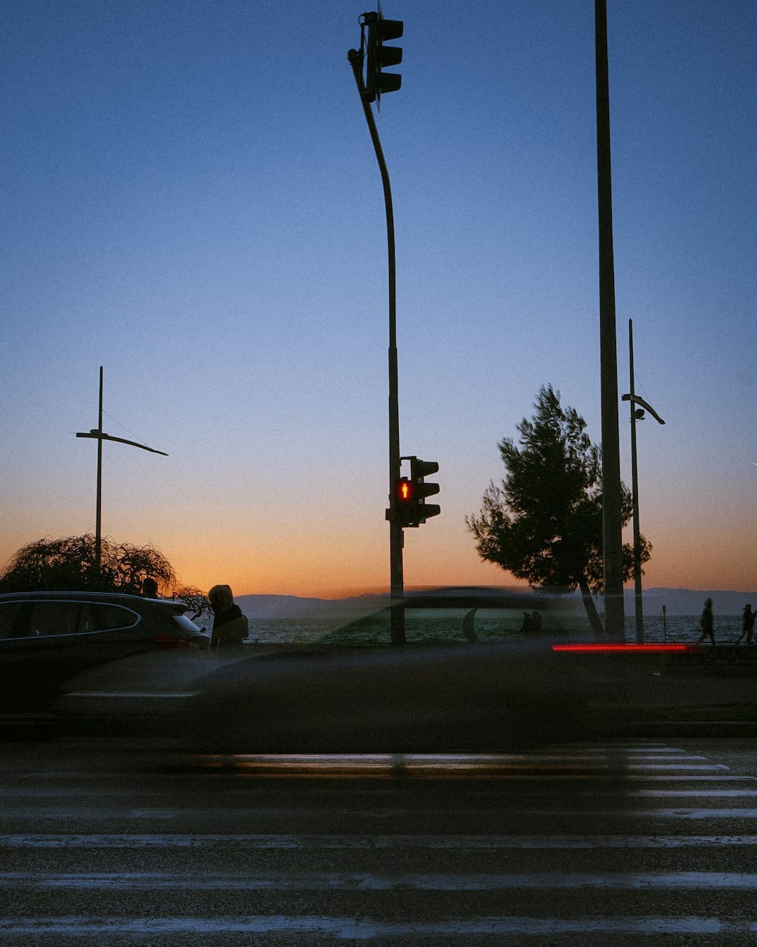 a traffic light sitting on the side of a road