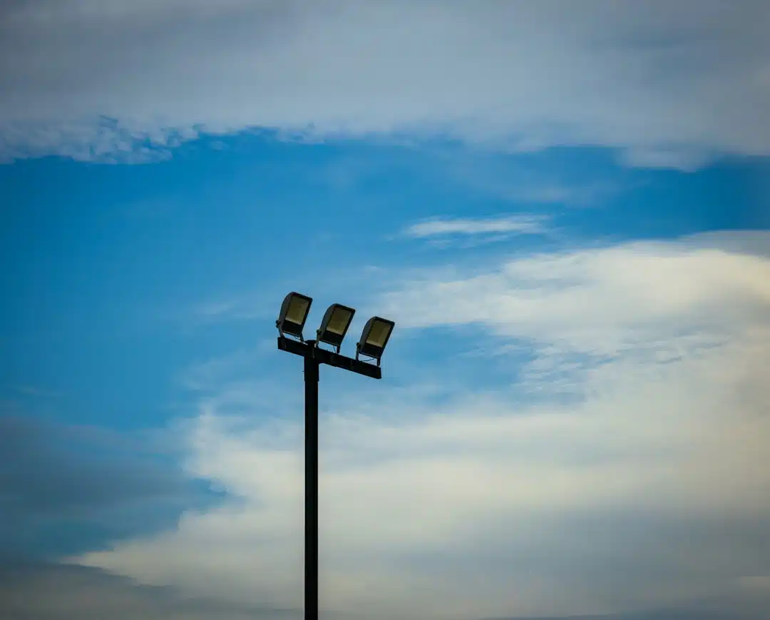 A couple of street lights sitting on top of a metal pole